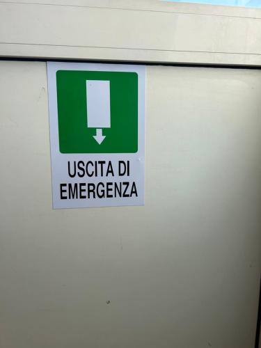 a sign on the side of a gas station at Residenza Parco Gioeni in Catania