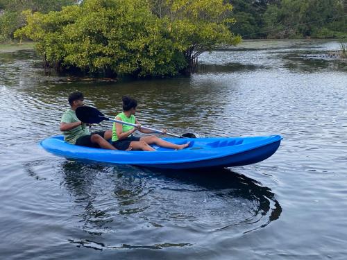 two people on a blue kayak in the water at Seth Villa by Magampura Resorts in Tangalle
