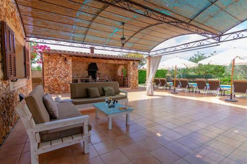 a living room with a couch and a table at Villa Sanchez in Campos