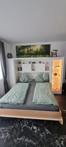a bed in a room with two pillows at Koasablick in Ebbs