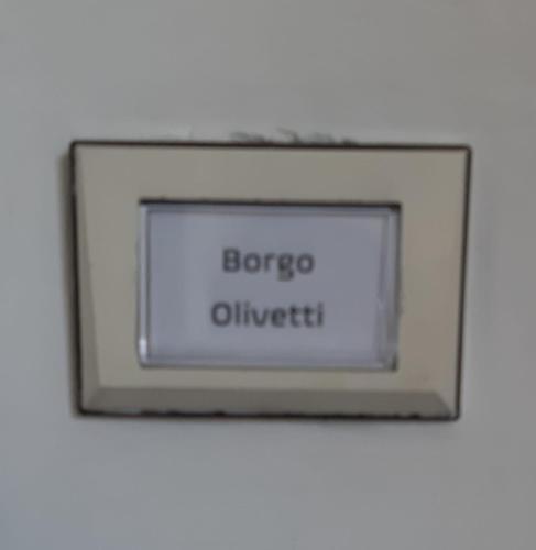 a sign with the words bacco outbreak on it at Apartment "Borgo Olivetti" in Ivrea