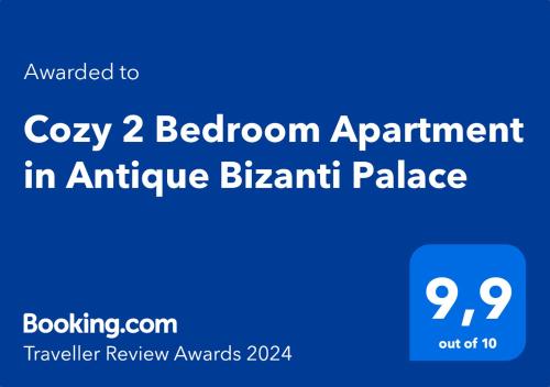 a blue sign with the words cozy bedroom apartment in antioch palace at Cozy 2 Bedroom Apartment in Antique Bizanti Palace in Kotor
