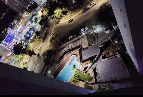 an overhead view of a house with a swimming pool at Departamento Frente al Casino Luckia 3H 2B in Arica