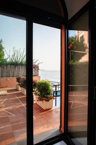 a view from a window of a patio with plants at Villa Margi in Vico Equense