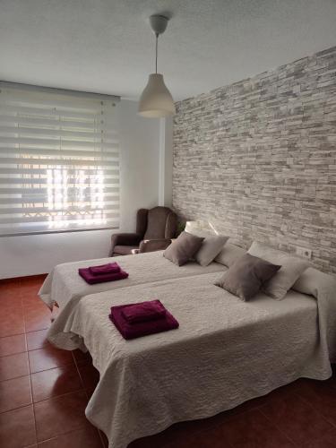 Llit o llits en una habitació de MALAGA EXPERIENCE
