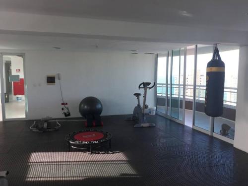 a room with a gym with a punching bag at Cantinho de Iracema in Fortaleza