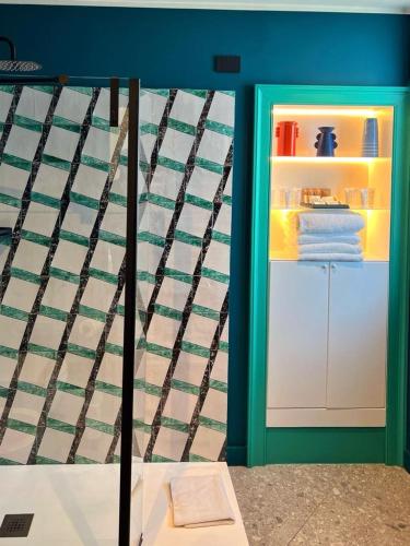 a room with a bed and a refrigerator at 1912 Relais - Sorrento Coast in Piano di Sorrento