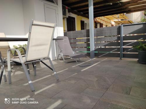two chairs and a table on a patio at Ellena Sunshine in Opatija