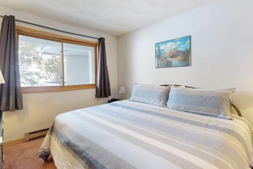 a bedroom with a large bed and a window at East Bay 6 in Dillon