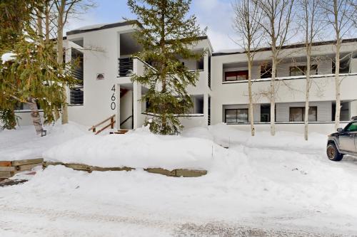 a building covered in snow with a car parked in front at East Bay 6 in Dillon