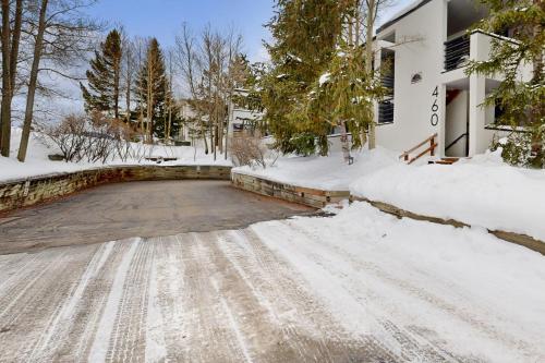 a driveway covered in snow in front of a house at East Bay 6 in Dillon