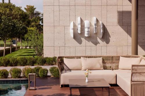 a living room with a couch and a table at Bayou Villas Antalya - Ultra All Inclusive in Antalya