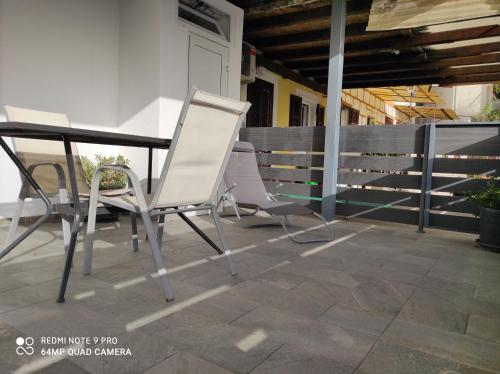two chairs and a table on a patio at Ellena Sunshine in Opatija
