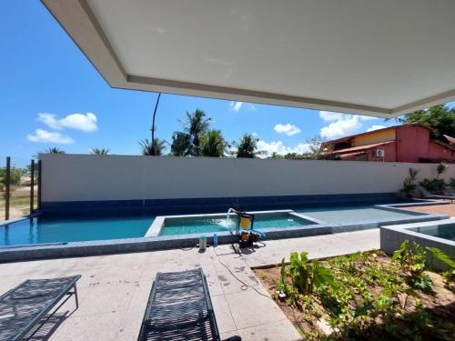 Kolam renang di atau dekat dengan APTO 107-Pé na Areia Praia do Maceio - 2 suites, 2 banheiros+SPA Jacuzzi+Roupas de cama