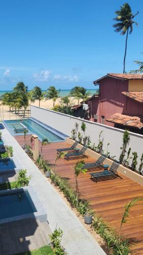 Kolam renang di atau dekat dengan APTO 107-Pé na Areia Praia do Maceio - 2 suites, 2 banheiros+SPA Jacuzzi+Roupas de cama