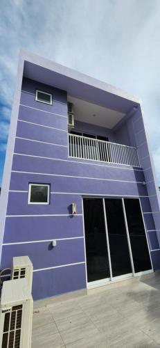 a purple building with windows and a balcony at La Belle Maison 12 @ Gurney Kelawai/Pulau Tikus/Georgetown in George Town