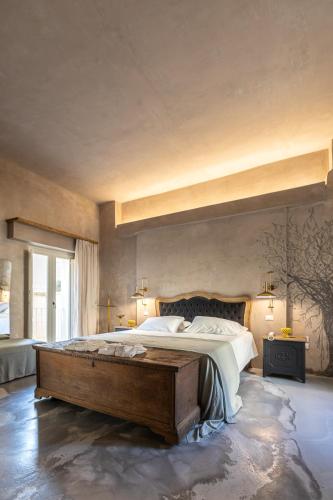 a large bedroom with a large bed in a room at Palazzo Sant'Anna Lecce in Lecce