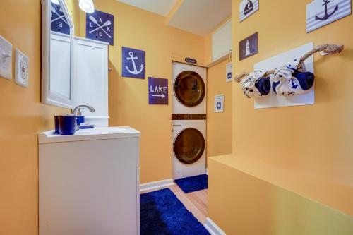 a laundry room with a washer and dryer at Lakefront Eatonton Getaway with Dock and Grill! in Resseaus Crossroads