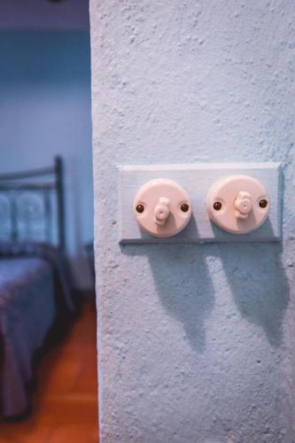 two electrical outlets on a wall in a room at Agriturismo La Costa - Casa Vacanze in Perego