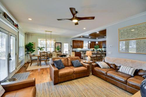 a living room with a couch and a ceiling fan at Lakefront Jacksons Gap Retreat with Grill and Dock! in Jacksons Gap