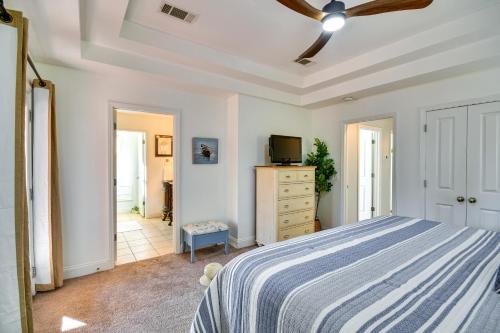 a bedroom with a bed and a ceiling fan at Lakefront Jacksons Gap Retreat with Grill and Dock! in Jacksons Gap