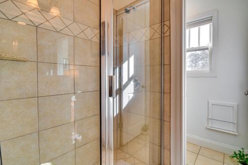 a shower with a glass door in a bathroom at Lakefront Jacksons Gap Retreat with Grill and Dock! in Jacksons Gap