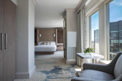 a hotel room with a bed and a large window at Baltimore Marriott Waterfront in Baltimore