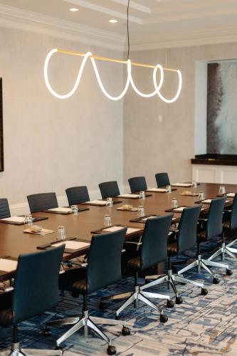 a large conference room with a long table and chairs at Baltimore Marriott Waterfront in Baltimore