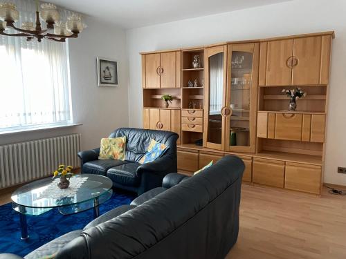 a living room with a couch and a table at Ferienhaus Brandes Wohnung 2 in Norderney