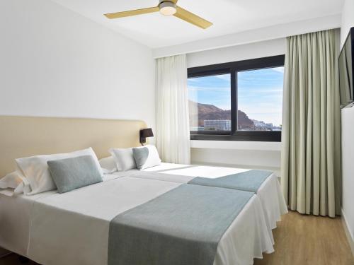 A bed or beds in a room at XQ Vistamar