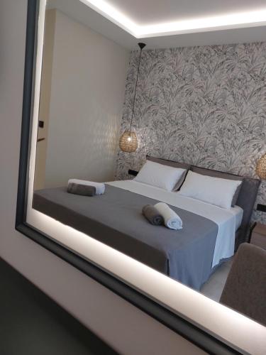 a bedroom with a bed with two pillows on it at Nastazia Studios in Laganas