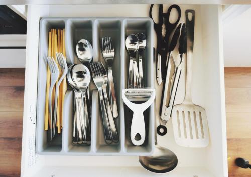 a drawer filled with silver utensils at 枕木 New house with Huge View for Family-Group in Tokyo