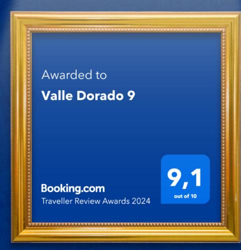 a gold picture frame with a blue background at Valle Dorado 9 in Coco