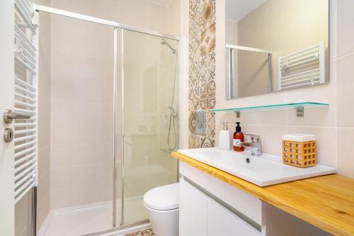 a bathroom with a sink and a shower at WHome Beato Premium River View in Quiet Area in Lisbon