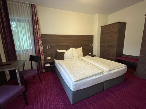 Postel nebo postele na pokoji v ubytování Ferienwohnung Pension am Weinberg