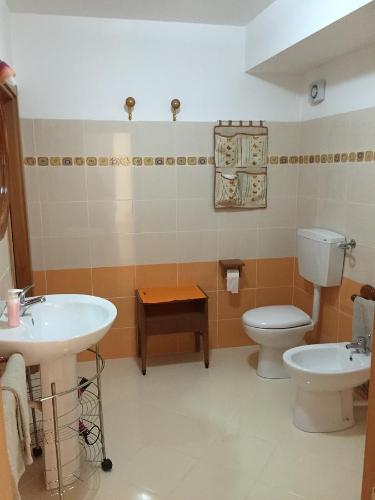 a bathroom with a sink and a toilet at Dall'Orso Grigio in Balestrate