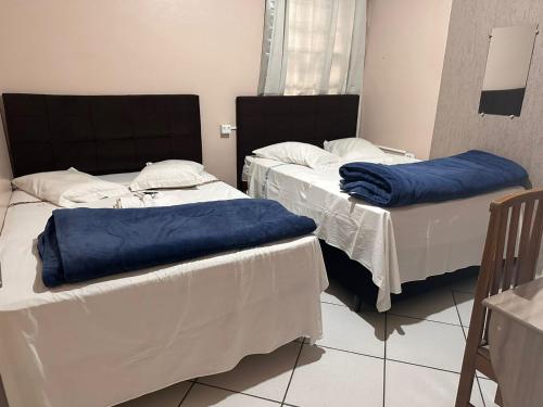 Postel nebo postele na pokoji v ubytování HOTEL Rafael