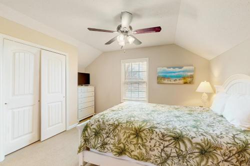 a bedroom with a bed and a ceiling fan at Snorkel Way in Myrtle Beach