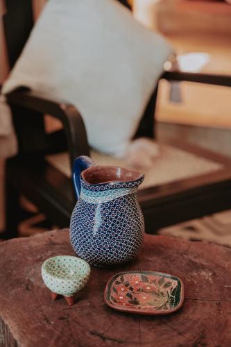 a blue and white vase sitting on top of a table at CASA CHAKÁ BOUTIQUE in Mérida