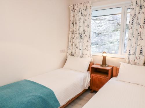 Voodi või voodid majutusasutuse Captains Lodge toas