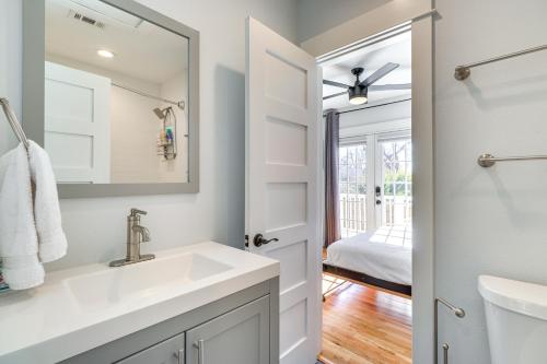 a bathroom with a sink and a mirror at Updated Austin Home about 1 Block to HikeandBike Trail! in Austin