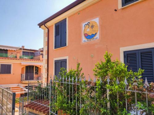 a building with a painting on the side of it at Casa Vacanze Maraldo in Marina di Camerota