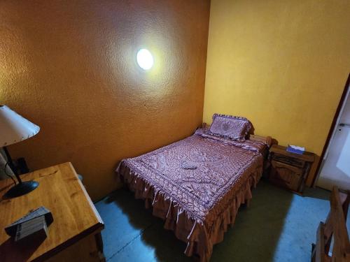 En eller flere senge i et værelse på Las Toninas Duplex 5