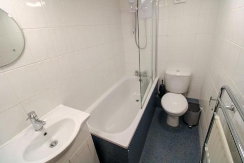 a white bathroom with a sink and a toilet at Grasmere View Grasmere in Grasmere