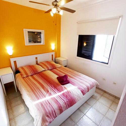 a bedroom with a bed and a window at Charming House with Boho terrace in Chayofa