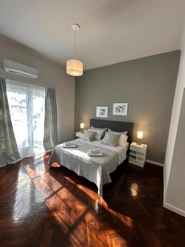 Ένα ή περισσότερα κρεβάτια σε δωμάτιο στο DEL900 apartamentos.