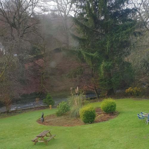 a park with a picnic table in the grass at Rydal Lodge in Rydal