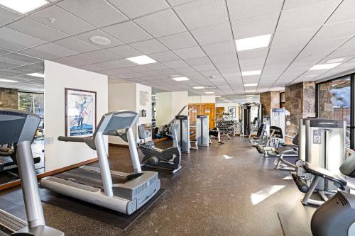 a gym with treadmills and cardio equipment in a room at Main Street Station in Breckenridge