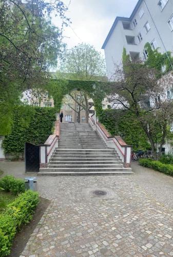 a set of stairs leading up to a building at Exquisite Berlin Apartment in Berlin