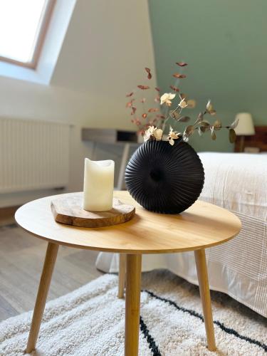 Un ou plusieurs lits dans un hébergement de l'établissement Mes Caprices B&B Villa Mosan Bord de Meuse